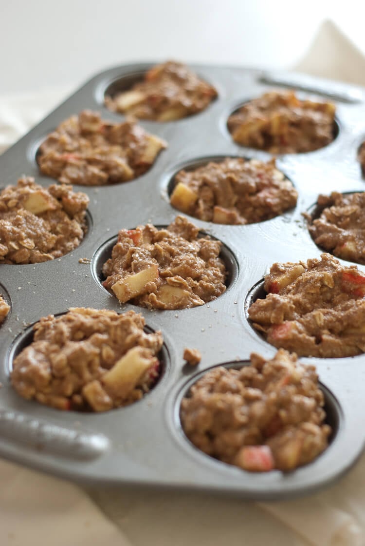 apple oatmeal muffins in muffin tin