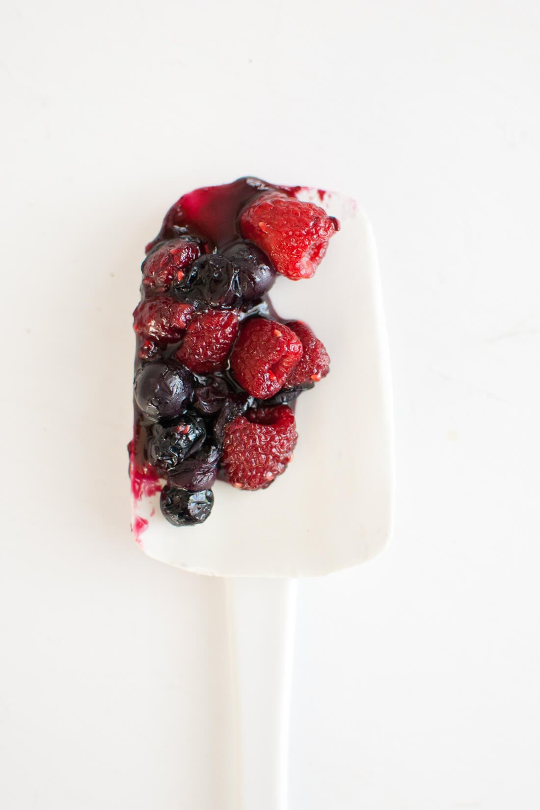 roasted blueberries and raspberries on spatula