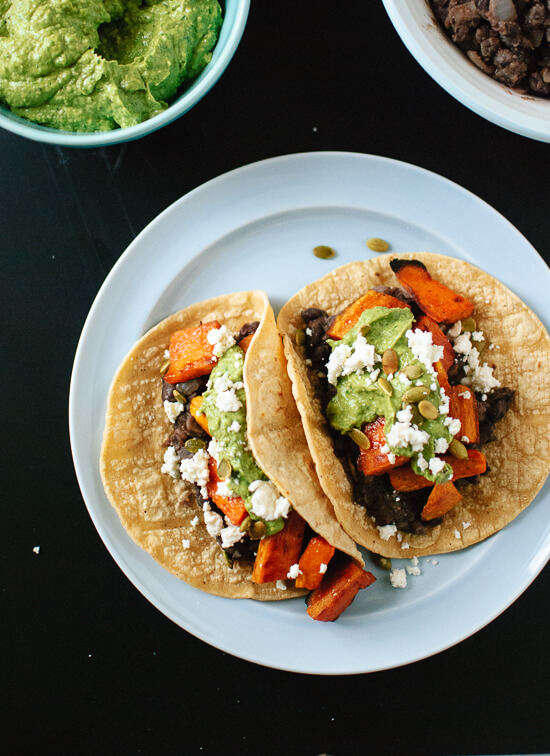 Sweet potato and black bean tacos with avocado-pepita dip - cookieandkate.com